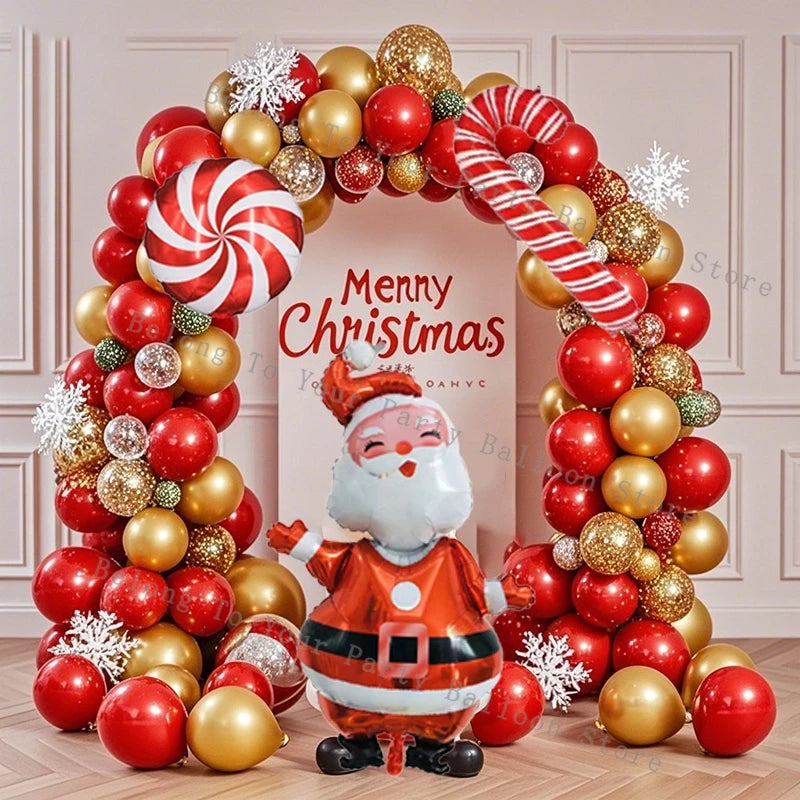 Decoración navideña: guirnalda de globos, arco, piruleta, bastón de caramelo, globo metalizado, globo rojo y verde.