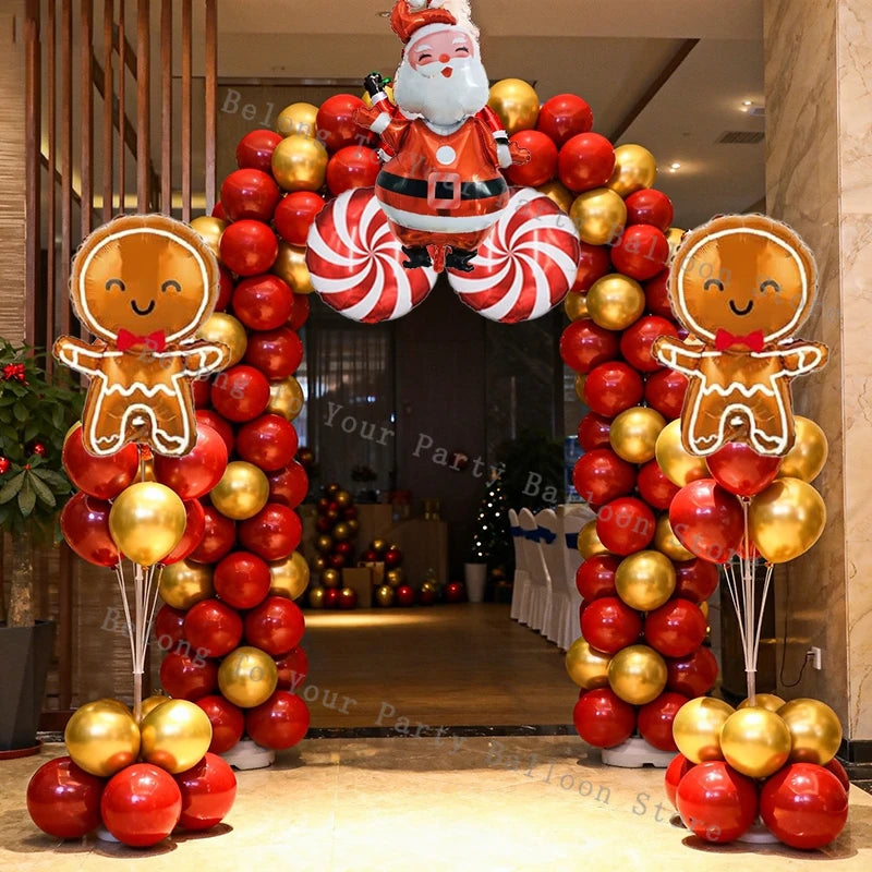 Decoración navideña: guirnalda de globos, arco, piruleta, bastón de caramelo, globo metalizado, globo rojo y verde.